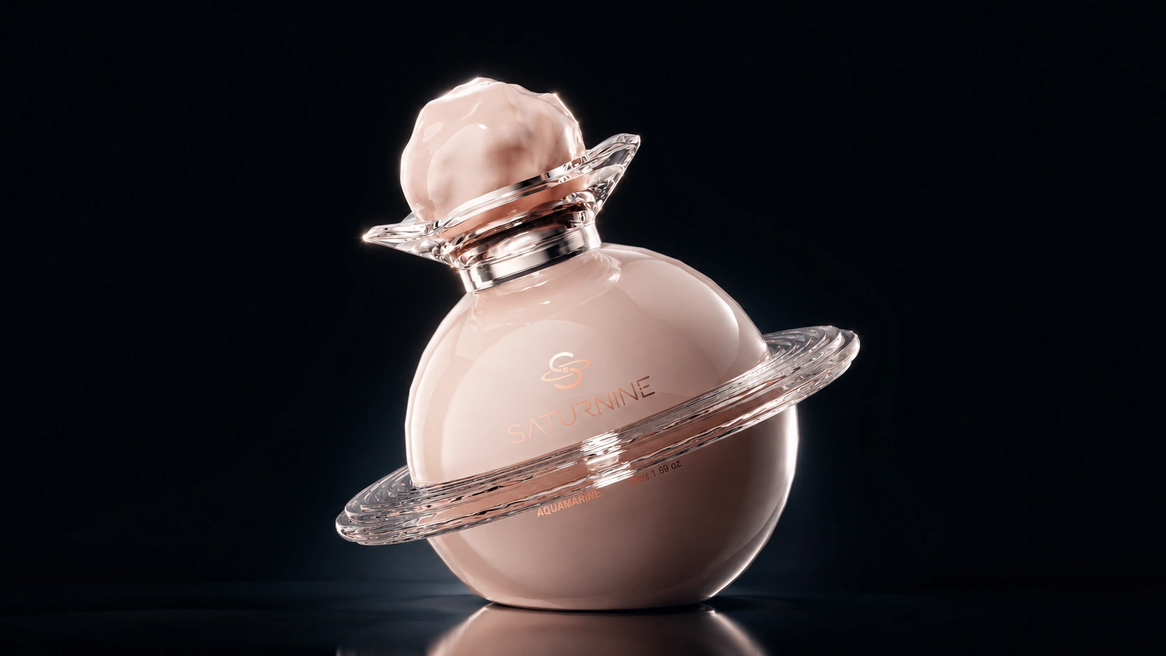 SATURNINE blush pink bottle: opaque pink glass sphere with a clear ring and collar, silver neck and pink textured cap, lit on black.