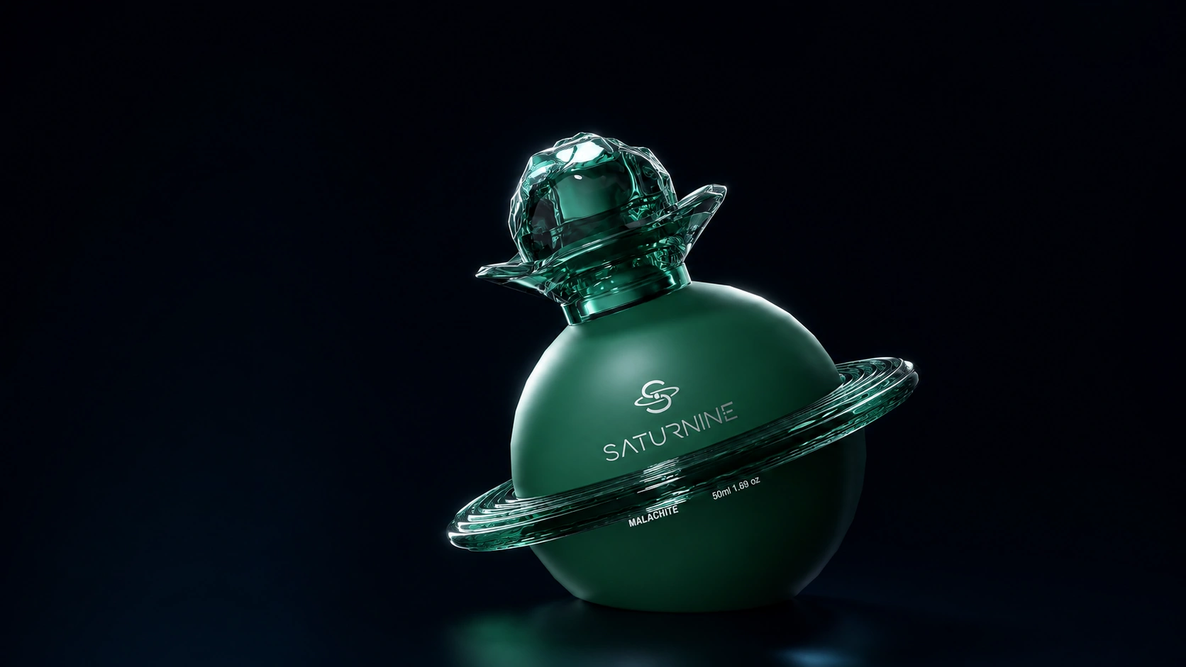 SATURNINE Malachite bottle: matte deep green glass sphere with a translucent green ring, collar and faceted cap, labeled 50ml on black.