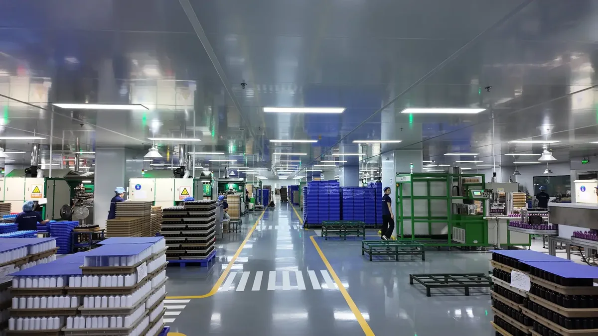 A Jarsking Packaging workshop floor with bottles on trays