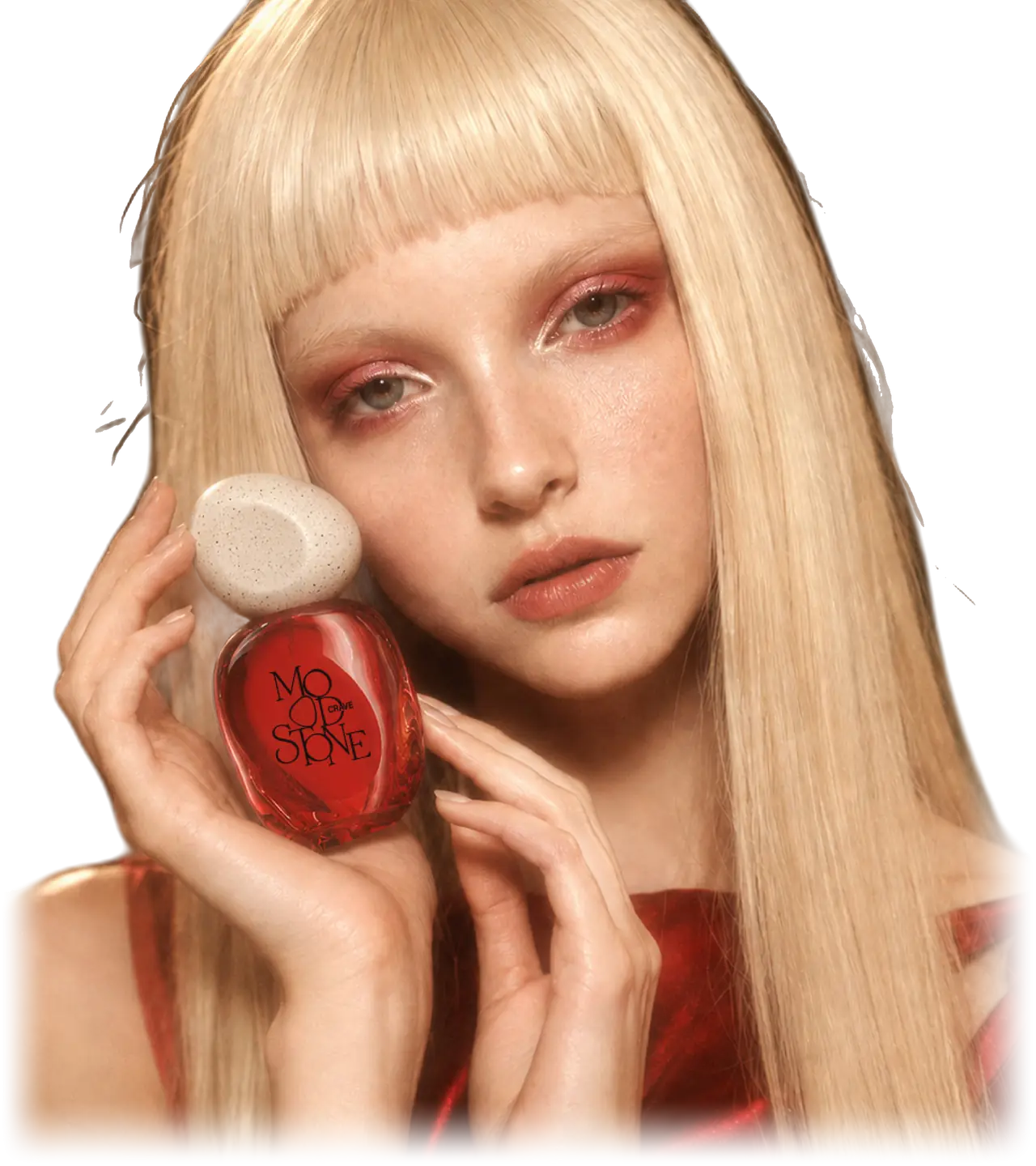 The CRAVE model with platinum hair and red eye shadow holding the red MOOD//STONE bottle against her cheek
