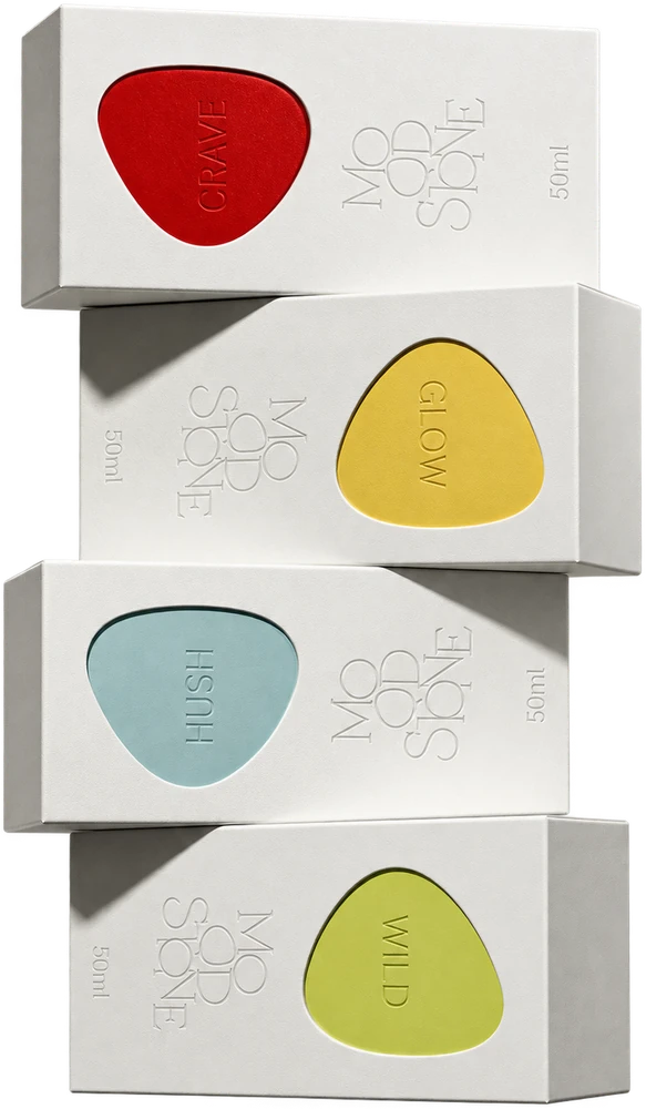 Four MOOD//STONE cartons stacked, matte white with a red, amber, blue and green pebble shape