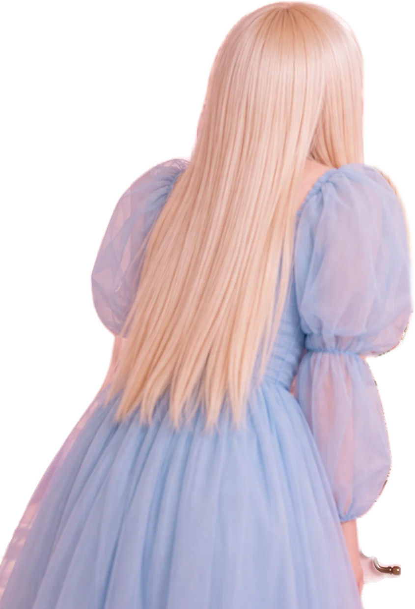 A girl in a pale blue tulle dress, seen from behind in a pink room, faces an open wardrobe where a doll-like version of herself leans out among the four MOOD//STONE bottles in red, amber, lime and pale blue