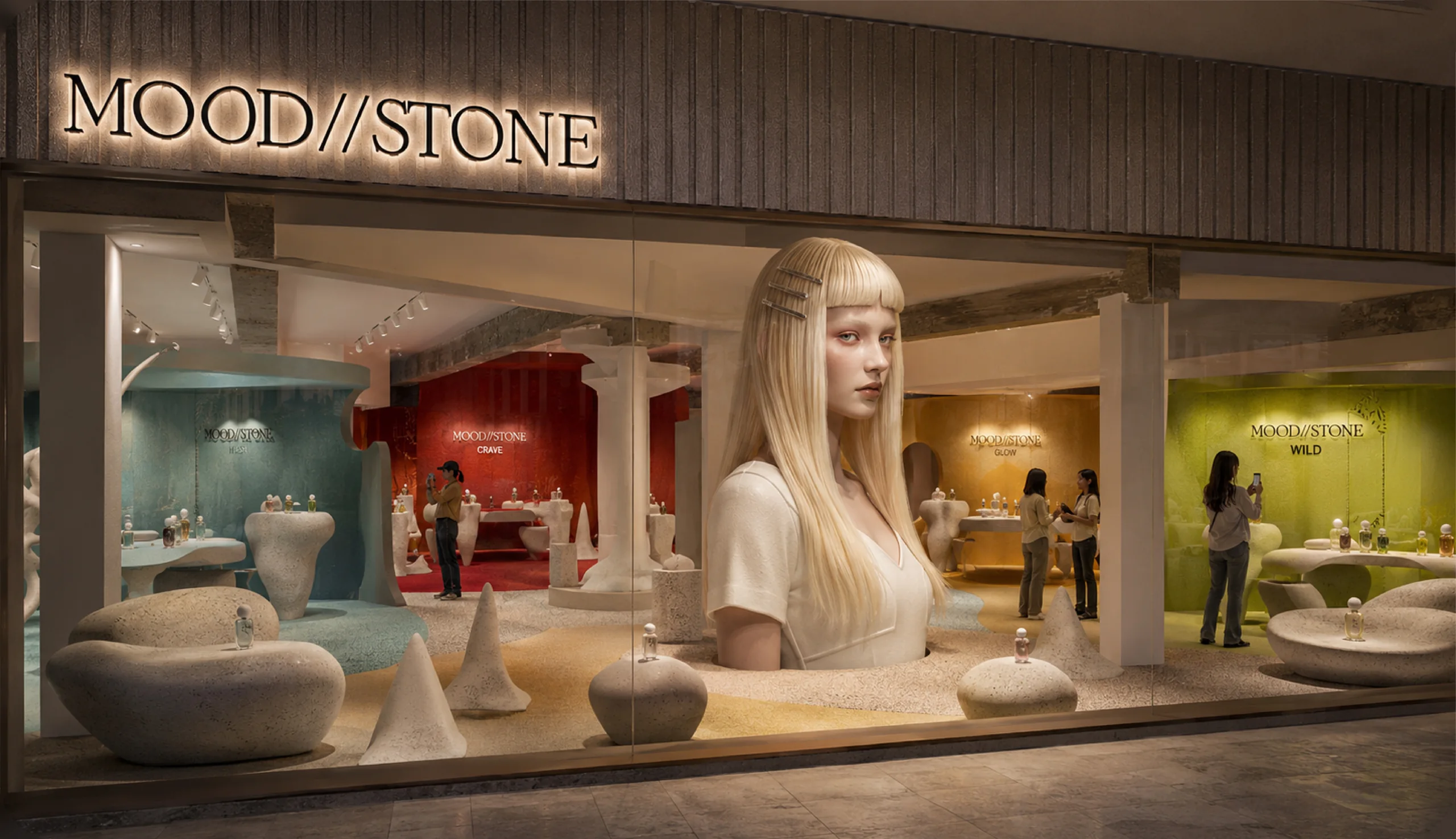 MOOD//STONE store concept: a shop window opening onto four color zones, blue, red, amber and green, with pebble-shaped seating and displays